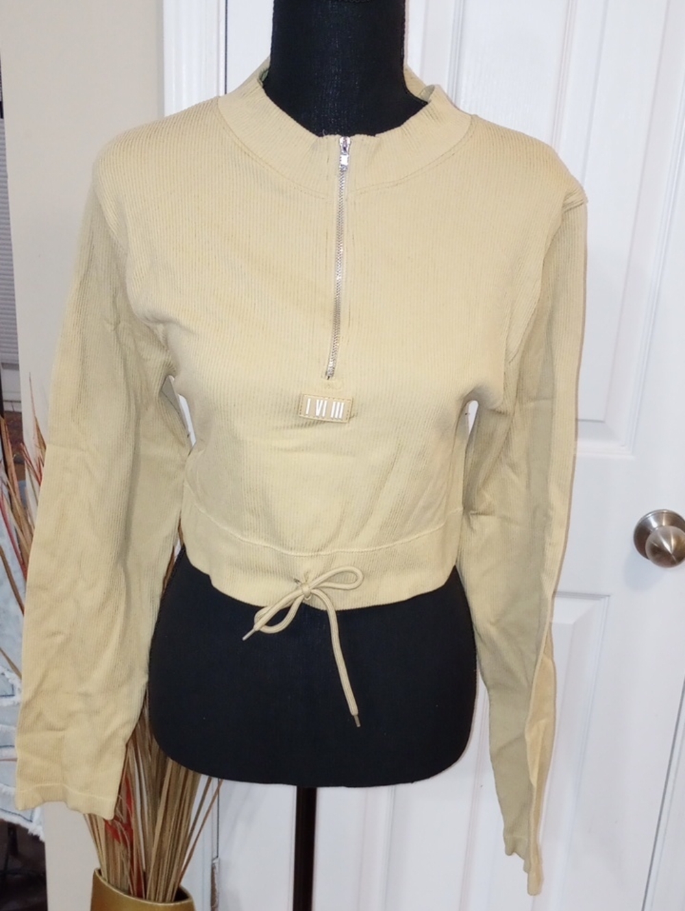 feathers Ribbed Half-Zip Crop Sweatshirt in Tan